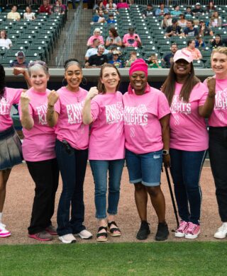 A group of Charlotte Radiology employees in pink T-shirts